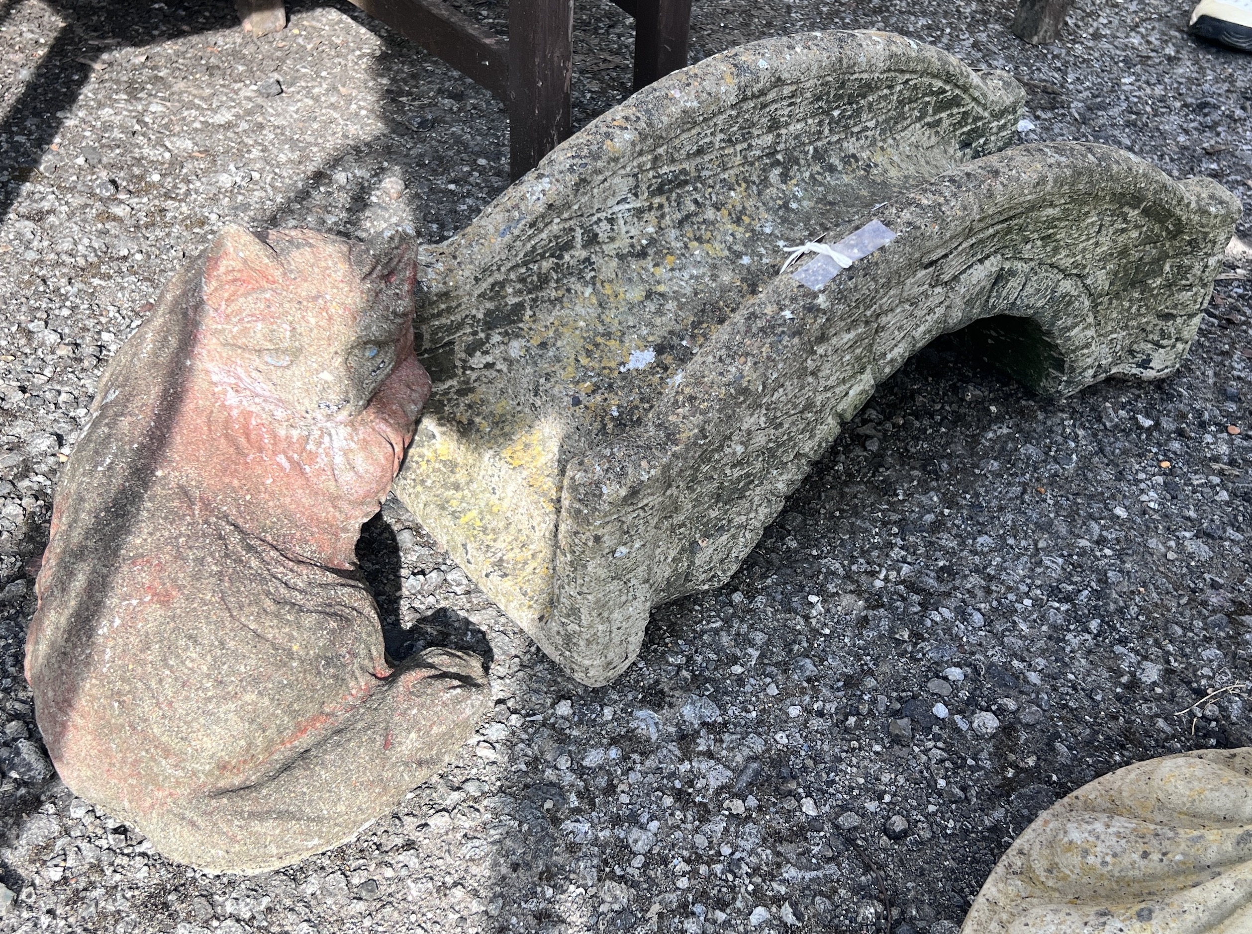 A reconstituted stone ornamental bridge garden ornament, length 59cm, height 25cm, together with a seated cat ornament